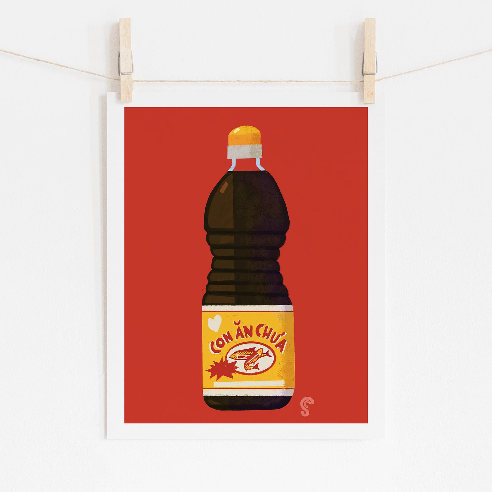 Illustration of a bottle labeled 'Con An Chua' on a red background